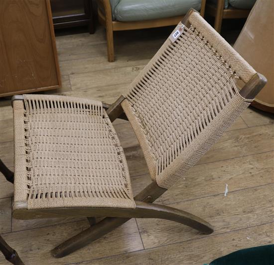A mid century folding chair, in the manner of Hans Weger